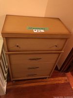 Front view of the vintage highboy dresser showing four drawers and labels with dimensions.