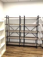 Front view of two assembled metal frame bookcases side by side