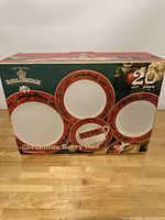 Box showing Christmas Berry Red 20 piece dish set by Pfaltzgraff with images of plates and mug featuring red berry holiday border design.