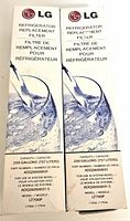 Front view of two LG refrigerator replacement water filter boxes side by side, showing branding and filtration capacity details