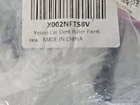 Close-up photo of part of the package label showing the brand Yosoo and product description.