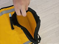 Close-up of the open inflatable kayak paddle float showing the inner air chamber and valve