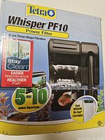 Box front showing Tetra Whisper PF10 power filter branding and aquarium size suitability (5-10 gallons), highlighting StayClean technology.