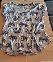 Front view of Love J USA women's T-shirt with elephant print, displaying short sleeves and round neckline