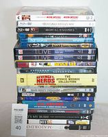 Stack of 18 Blu-ray and DVD movies showing titles and covers.