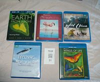 Front view of all five Blu-ray/DVD cases showing cover art and titles