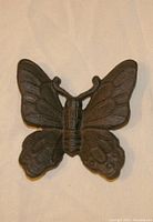 Front view of the cast iron butterfly showing detailed wings and body.