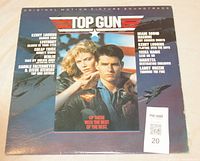 Front cover of Top Gun soundtrack vinyl record showing lead actors and song artists list.