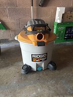 Front view showing the Rigid 2-in-1 label and foot pedals on the base wheels.