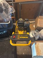 Side angle view showing engine, part of the frame, and wheels