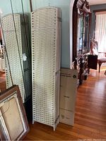 Panel folded closed showing woven texture and hinge details.