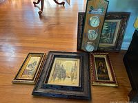 Overview photo of all six pieces: five framed paintings and one wooden barometer with painted mallard duck and cattail design.
