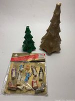 Green and gold Gurley vintage tree candles with unopened plastic nativity set in packaging.