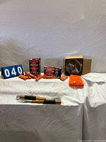 Overview of firestarters, tongs, boxed light, beanie