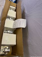 Fixture inside original cardboard box with styrofoam protection