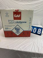 Front of sealed box showing brand, model, size, material