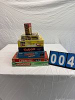 Stack of seven boxed games on table