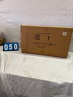 Sealed carton containing mirror