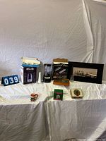 Full lot overview showing blender, empanada presses, board game, artwork, holiday items