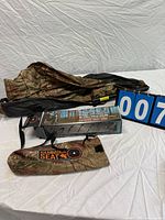 Camouflage hammock seat fabric, carry pouch and box displayed