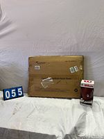 Sportneer boxed stadium seat chair and Wilson football in packaging