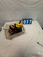 Tote with tools grouped