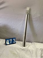 Boxed taupe cordless honeycomb shade full length