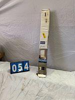 Full view of boxed window blind with lot number