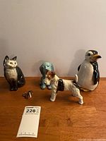 Group shot of all five figurines on tabletop