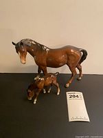 Both Beswick horse figurines with size reference