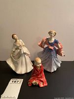 Front view of all three Royal Doulton figurines