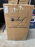 Front view of the Deco Chef commercial ice maker machine in its original cardboard box showing branding and product name.