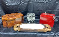 Front view of all five items in the lot: wooden decorative box, ceramic tissue box cover, red photo box with metal handle, wooden candle holder with three wicks
