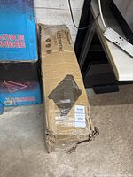 Damaged yet sealed cardboard box for Lifepro Pacer Mini Walking Pad, showing tape and wear from handling.