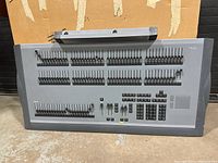 Full front view of the ETC Express 48/96 lighting control board with all faders and buttons visible.