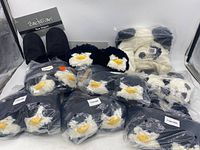 Group photo showing all slippers and hat, slipper packaging labels visible indicating size 4 and brand Pillow Pets