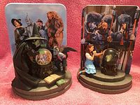 Two Bradford Exchange Wizard of Oz themed plates with 3D character figurines and illustrated backgrounds.