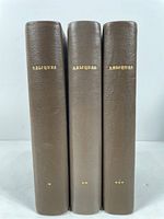 Three antique English poetry books in full brown leather covers, spines labeled 'REPLIQUES' in gold lettering, arranged standing upright for spine view.