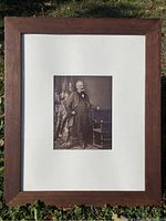 Full view of the framed antique photograph of Victor Hugo in a wooden frame with white matting, measuring approximately 23 x 19 inches.