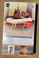 Box of K&H Thermo Kitty Sill heated cat bed showing cat on bed and brand logo.