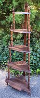 Full view of the vintage wooden corner stand showing its height and tiered corner shelves.