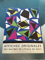 Front cover showing abstract geometric dust jacket design with title text