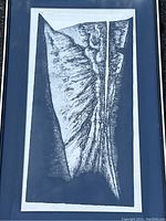 Close-up of the lithograph image showing abstract shapes in black and white with textured details.