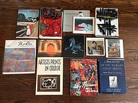 Overview of all 11 books showing covers with various modern art images