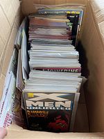 Box of approximately 60 sleeved comic books with visible X-Men Unlimited cover