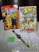 Photo of Longshot action figure in sealed packaging, X-Men comic book, and X-Men themed wristwatch
