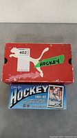 Red Puma box with 'hockey' label and 1991-92 O-Pee-Chee hockey card set box visible