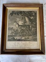 Full view of framed engraving showing stag in forest scene