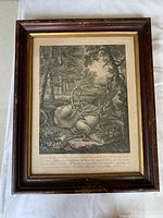 Framed engraving showing a forest hunting scene with a stag and hounds, signed or attributed to Johann Elias Ridinger.