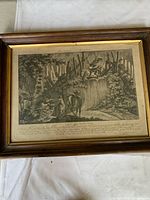 Framed copper plate engraving of hunting scene by Johann Elias Ridinger on aged paper with handwritten text below image.